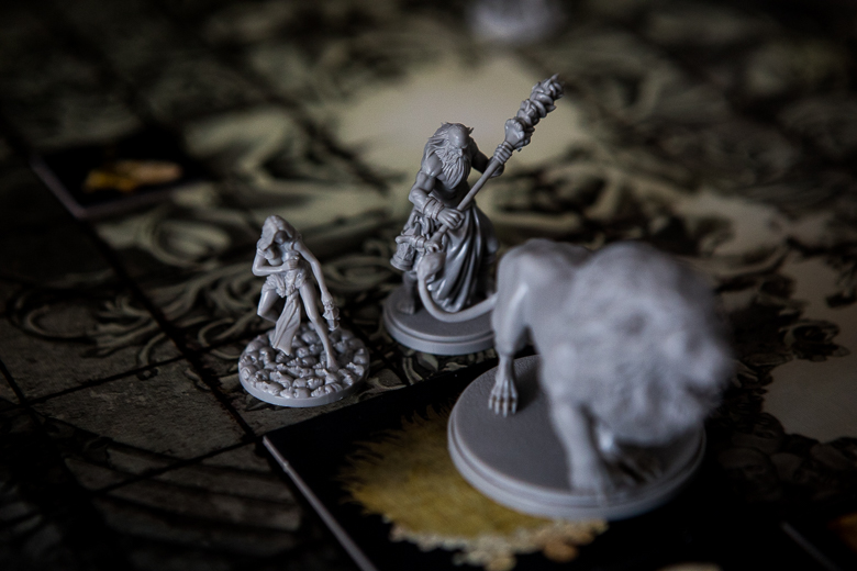 Kingdom Death Monster attacking the lion but failing